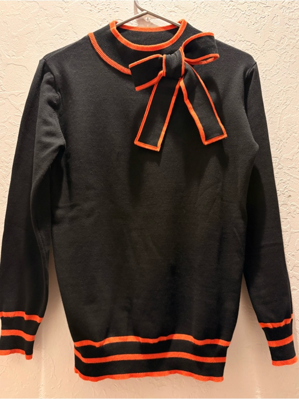 Oxknit Black Sweater with Orange Trim and Bow